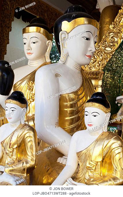 Myanmar, Yangon, Yangon. Many Buddhas at the Shwedagon Temple Complex in Yangon in Myanmar
