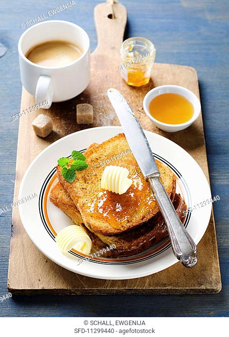 French toast with butter and jam served with coffee