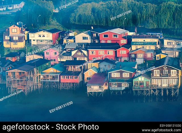 High angle shot of typical palafito houses at lake in Castro city, Chiloe Island, Chile