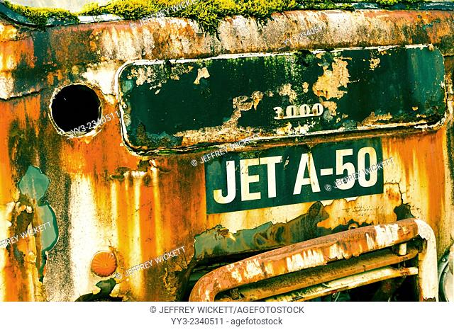 Front end of a rusty old jet fuel truck parked in a gravel pit near Sitka, Alaska