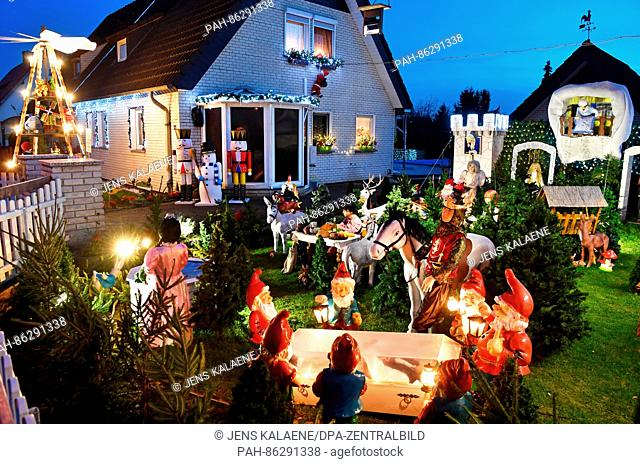 The garden of a house belonging to the Schultz family decorated with numerous Christmas lights and figurines in Dessau, Germany, 24 November 2016