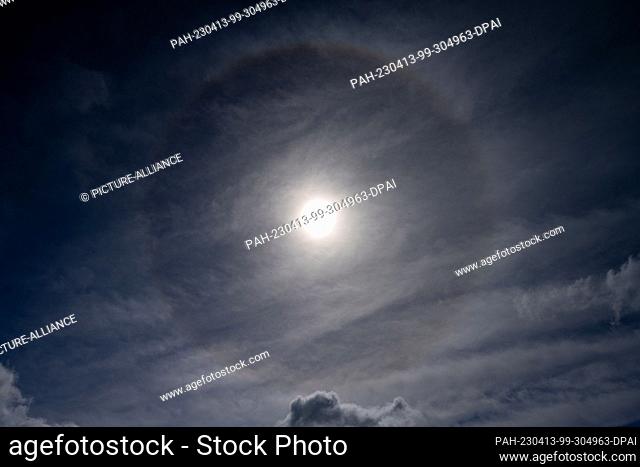 13 April 2023, Mecklenburg-Western Pomerania, Franzburg: A halo appearance in the sky. It is a light effect of atmospheric optics