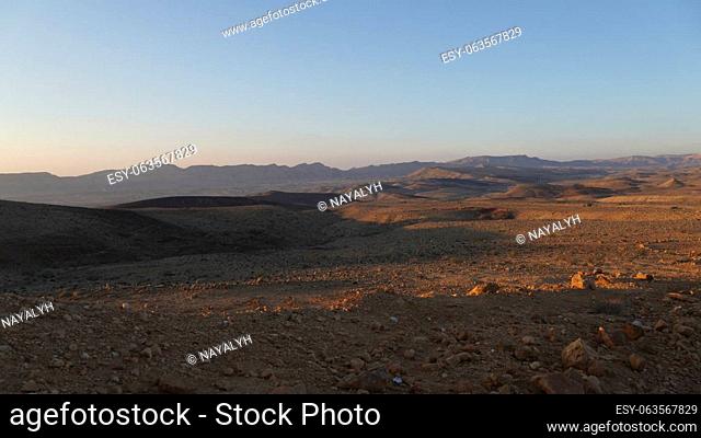 Negev desert landscape at sunrise on the bottom of the crater Makhtesh Gadol, in the south of Israel