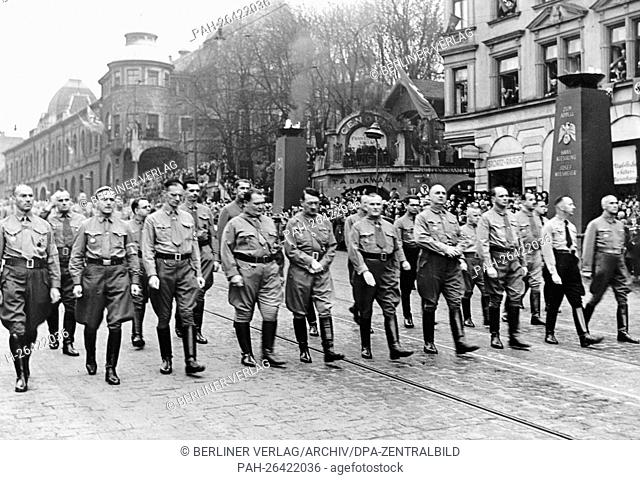 Adolf Hitler (m), Hermann Göring (4-l) and Ulrich Graf (6-l) march towards the Feldherrenhalle to commemorate the Beer Hall Putsch of November 1923 in Munich