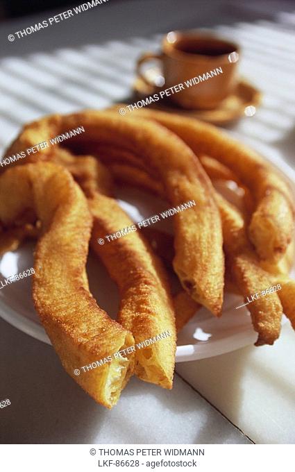 Churros con chocolate, a kind of funnel cake served with a cup of hot chocolate, Close-up