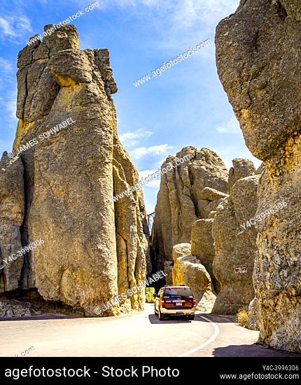 Car in Needles Eye Tunnel on the Needles Highway in Custer State Park in the Black Hills of South Dakota USA