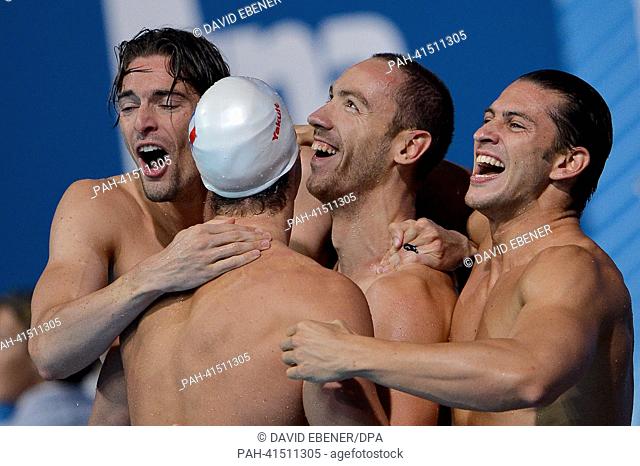 Camille Lacourt (L), Jeremy Stravius (2-R) Giacomo Perez D'ortona (R) and Fabien Gilot (2-L) of France celebrate after winning the men's 4x100m Medley relay...