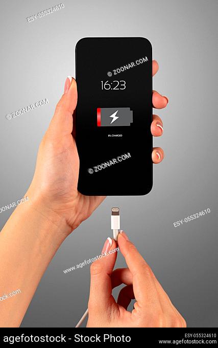 Elegant hand charging smartphone with low battery
