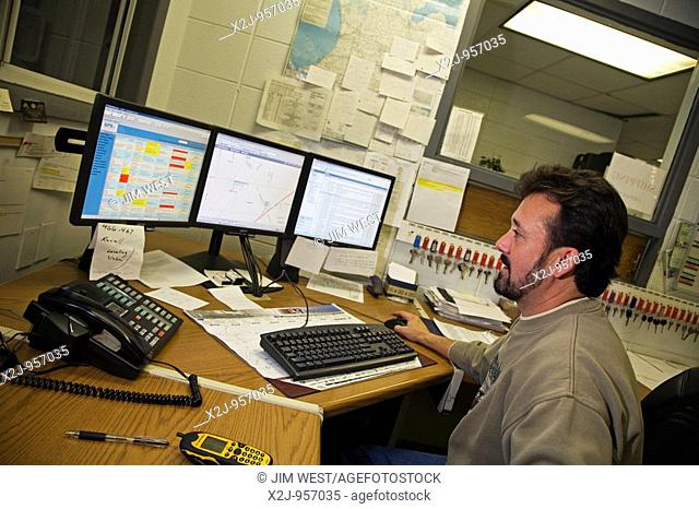 Romulus, Michigan - Tom Zoccoli, operations dispatcher for The Outbound Group, a trucking company, monitors and dispatches the company's drivers from its office...