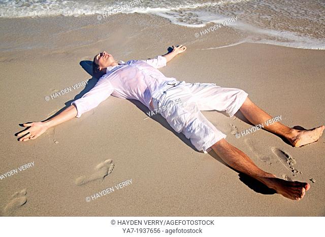 Man Lying on Beach