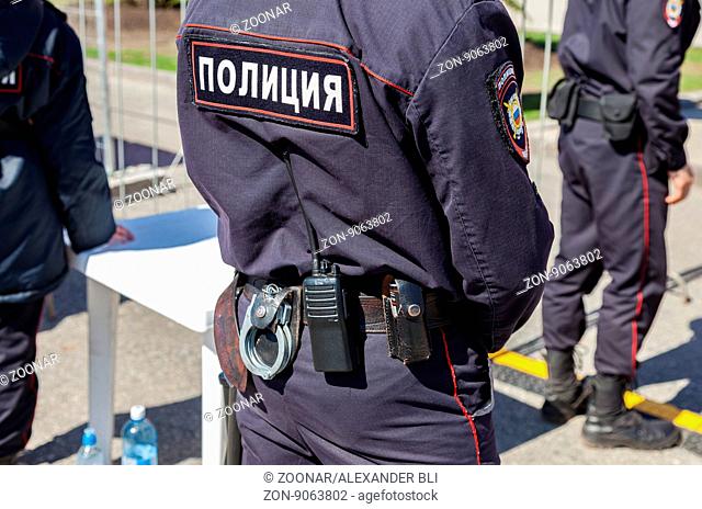 SAMARA, RUSSIA - APRIL 24, 2016: Equipment on the belt of Russian policeman. Text in russian: Police