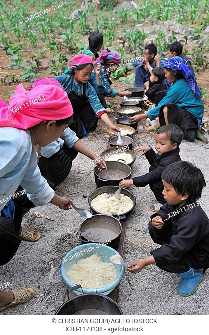 H'mong women taking communal lunch during funeral in a village around Sa Phin, Ha Giang province, Northern Vietnam, southeast asia
