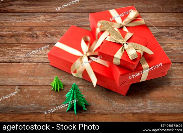 gift boxes and christmas trees on wooden boards