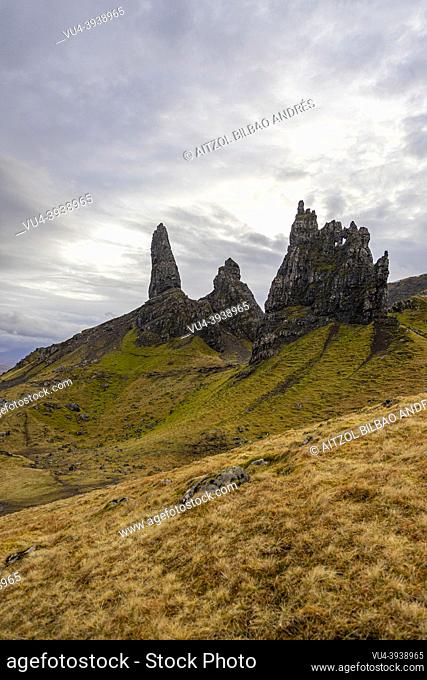 Old Man of Sotrr, big cliff, cloudy day, sun rays, mountain landscape, Skye Island, Highlands, Scotland