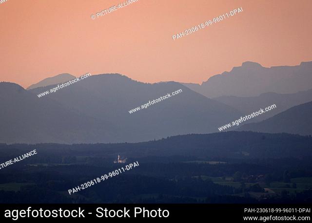 dpatop - 18 June 2023, Bavaria, Steingaden: In the sunrise, the Wieskirche stands in front of the panorama of the Alps. Photo: Karl-Josef Hildenbrand/dpa