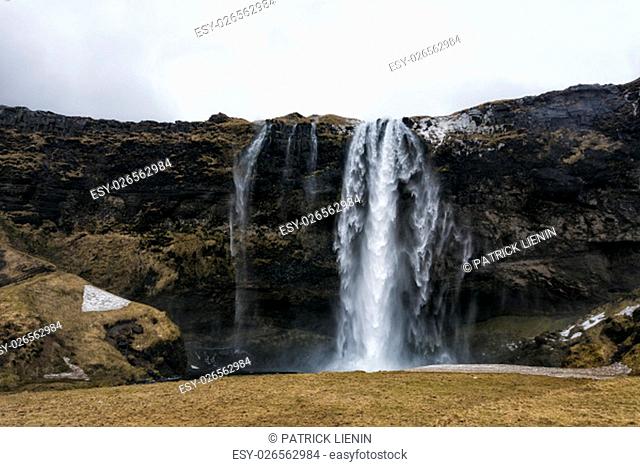 Dramatic waterfall in southern Iceland, close to the coast