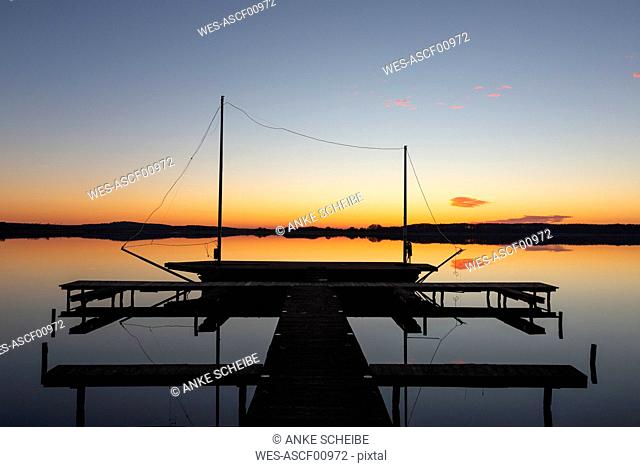 Germany, Brandenburg, Rangsdorfer See, pier and sailing boat