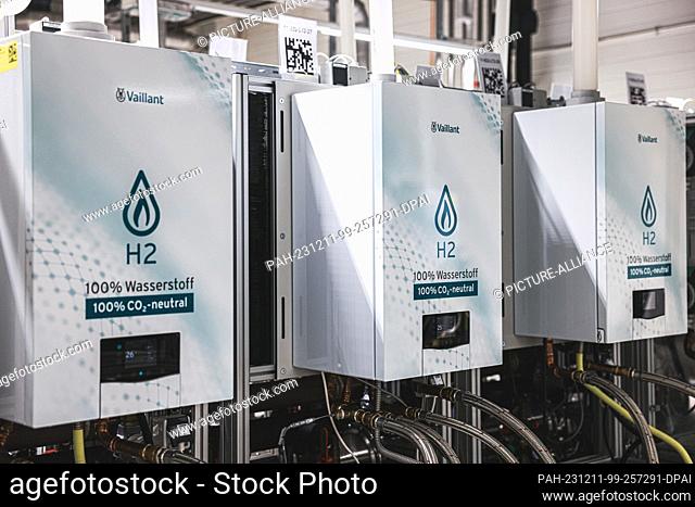 PRODUCTION - 11 December 2023, North Rhine-Westphalia, Remscheid: Hydrogen heating appliances run on a test bench in the laboratory of the manufacturer Vaillant