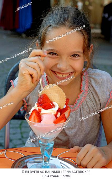 Girls having a big sundae, Bavaria, Germany