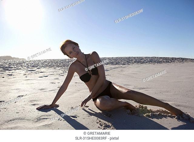 Girl laying on beach