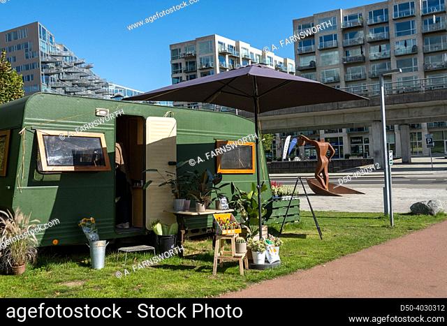 Copenhagen, Denmark Modern buildings in the new Orestad district and a small garden shop in a trailer
