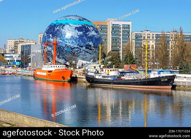 Kaliningrad, Russia, April 6, 2020. Museum display ship. An exhibit of the. Embankment of the maritime museum. Circular sphere building