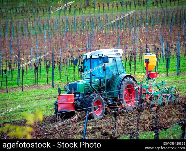 Tractor working at a vineyard in Burgenland