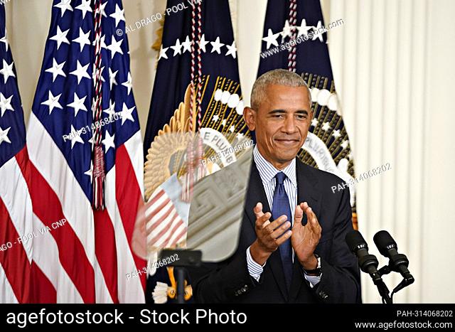 Former United States President Barack Obama claps while speaking during a ceremony for the unveiling of his official White House portrait in Washington, D