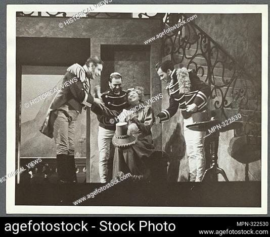Woman smiling, surrounded by three men. United States. Works Progress Administration (Sponsor). Federal Theatre Project Productions Theater Stills Collection...