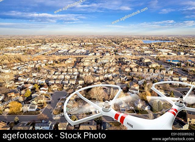 aerial view of typical residential neighborhood along Front Range of Rocky Mountains with a drone flying