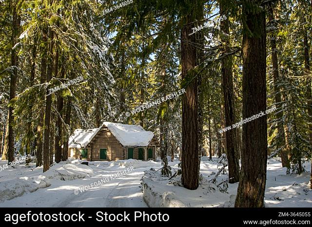 A cabin in the snow near Crystal Mountain and Ashford, Washington at the Nisqually Entrance of Mount Rainier National Park, USA