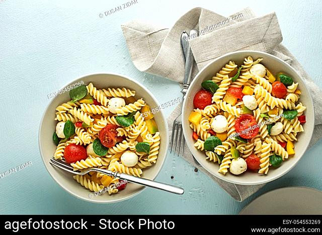 Pasta with mozzarella cheese and vegetables. Healthy pasta meal