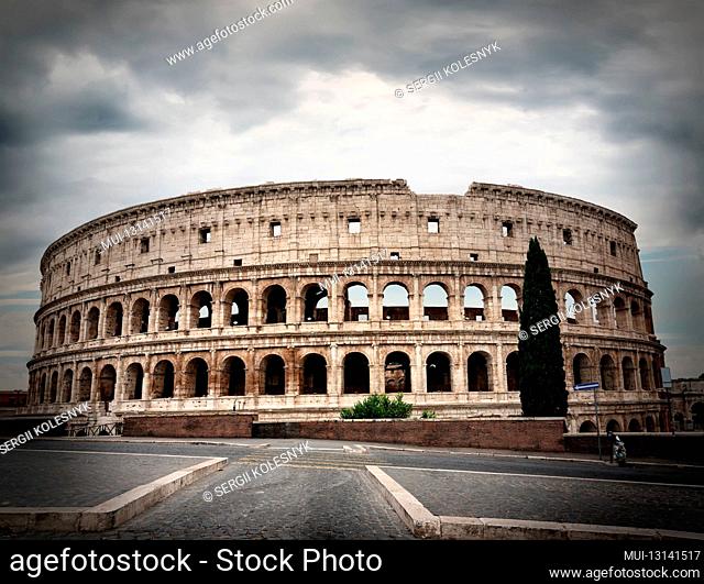 Gray thunder clouds over ancient Colosseum in Rome