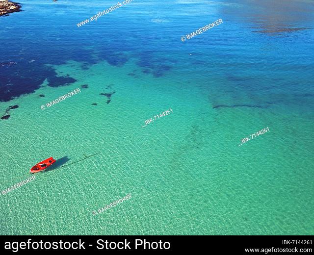 Red boat in crystal clear water, Haukland, Leknes, Lofoten, Nordland, Scandinavia, Norway, Europe