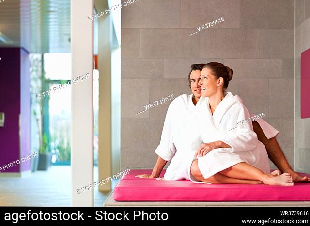 Young couple in bathrobe in Spa, they presumably having their honeymoon