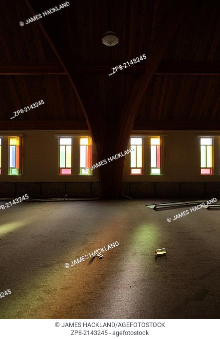 Colourful light pours through stained glass windows in the Harvest Bible Chapel in Oakville, Ontario, Canada. This Church has been demolished so there is no...