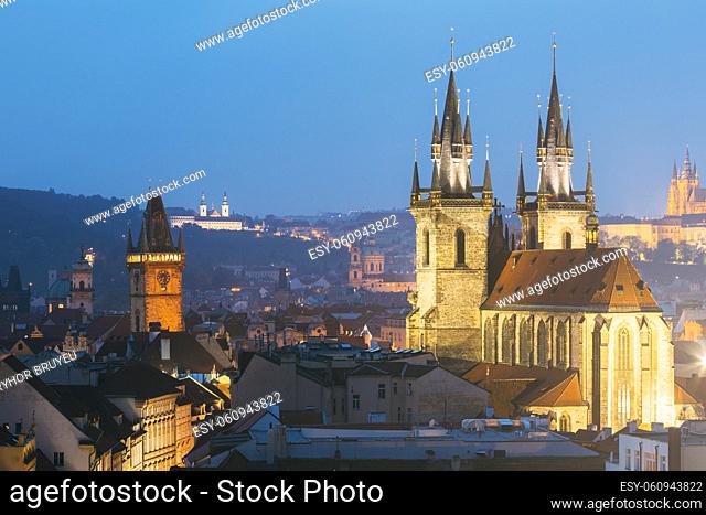 Night cityscape of Prague, Czech Republic. Famous Old town hall, Church Of Our Lady Before Tyn