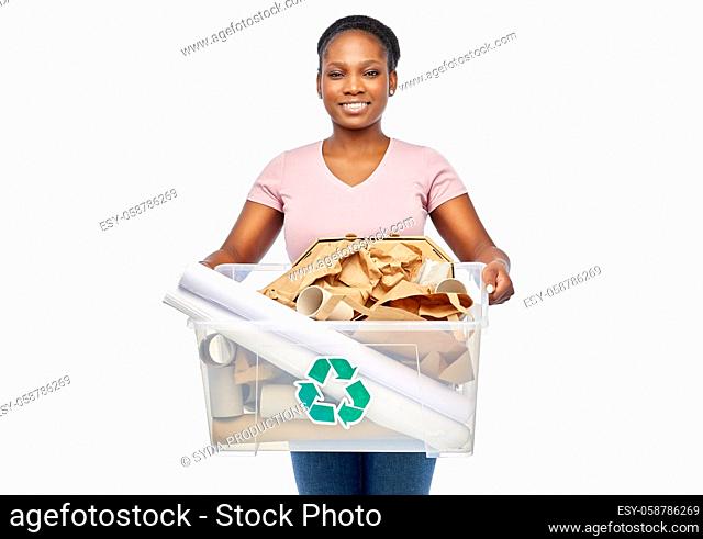 happy african american woman sorting paper waste