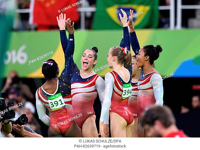 The Women's Artistic Gymnastics team from the USA celebrates during the Artistic Gymnastics Women's Team Final of the Rio 2016 Olympic Games at the Rio Olympic...