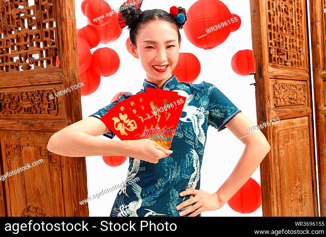 The New Year happy woman with a red envelope