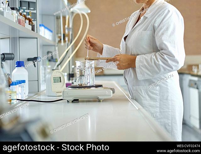 Scientist doing scientific experiment in laboratory