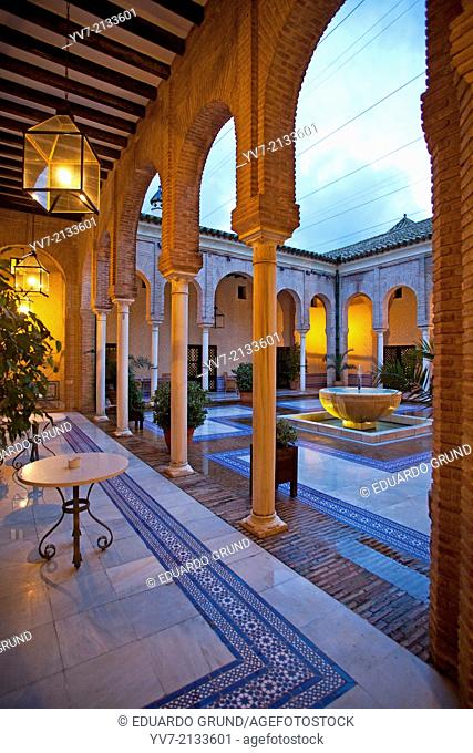 Courtyard of the Parador de Carmona, Neomudejar style built next to the Fortress of the King Don Pedro I "" The Cruel"". Carmona, Seville, Andalusia, Spain