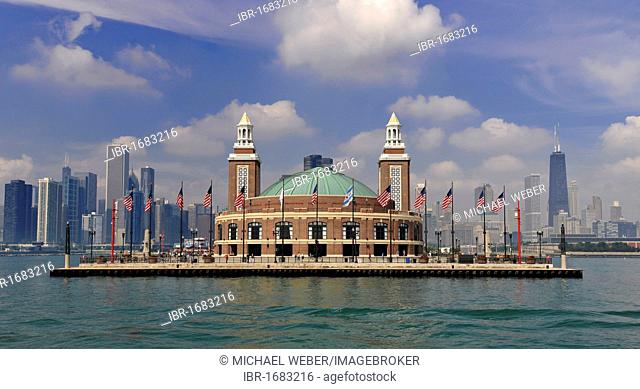 Navy Pier amusement park seen from Lake Michigan in front of the skyline with the John Hancock Center and the Aon Building, Chicago, Illinois
