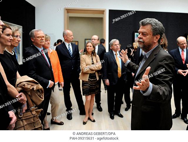 Director of the Lenbachhaus Helmut Friedel (R) talks to guests during the re-opening ceremony for the renovated Lenbachhaus in Munich,  Germany, 07 May 2013