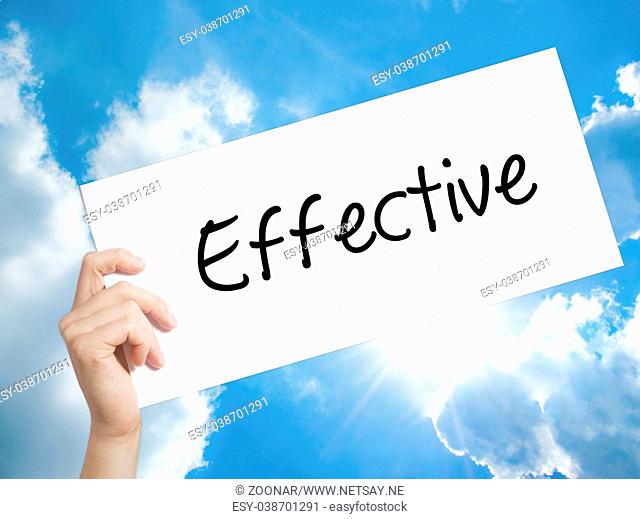 Effective Sign on white paper. Man Hand Holding Paper with text. Isolated on sky background