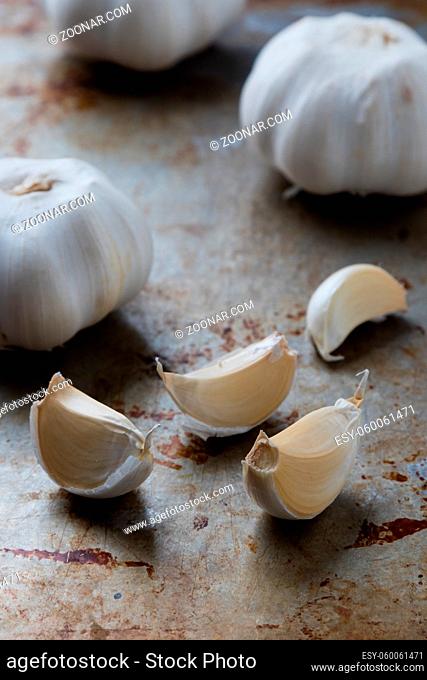 natural healthy garlic on grungy steel plate