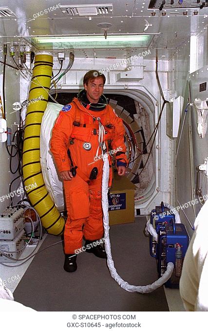 07/23/1997 --- STS-85 Payload Specialist Bjarni V. Tryggvason poses in the white room at Launch Pad 39A with his ascent/reentry flight suit as he prepares to...