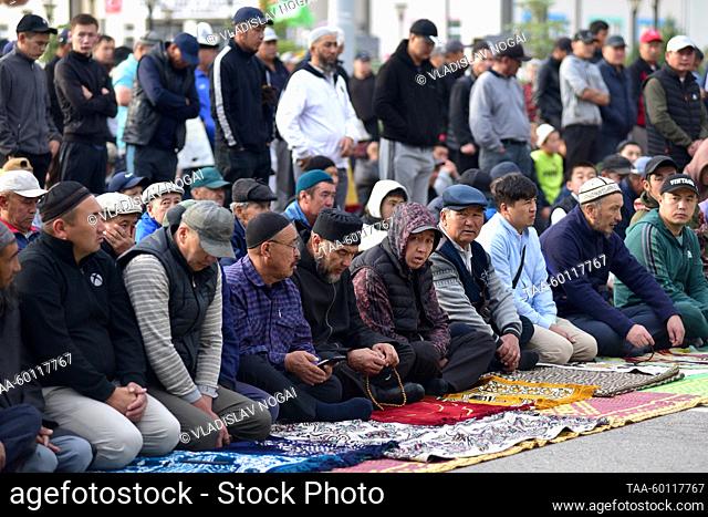 RUSSIA, KYRGYZSTAN - JUNE 28, 2023: Muslims pray in Lenin Street in the town of Naryn during Eid al-Adha (or Kurban Bairam, 'feast of the sacrifice')