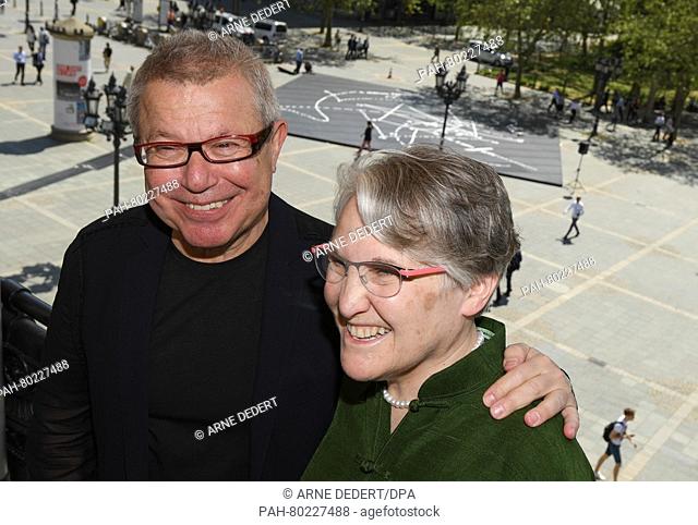 Daniel Libeskind (L), US architect and urban planner of Polish descent, and his wife Nina pose on the balcony of the Old Opera in Frankfurt