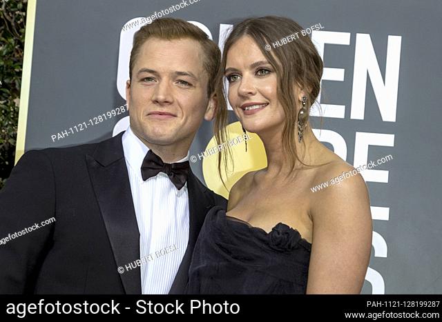 Taron Egerton and Emily Thomas attend the 77th Annual Golden Globe Awards, Golden Globes, at Hotel Beverly Hilton in Beverly Hills, Los Angeles, USA